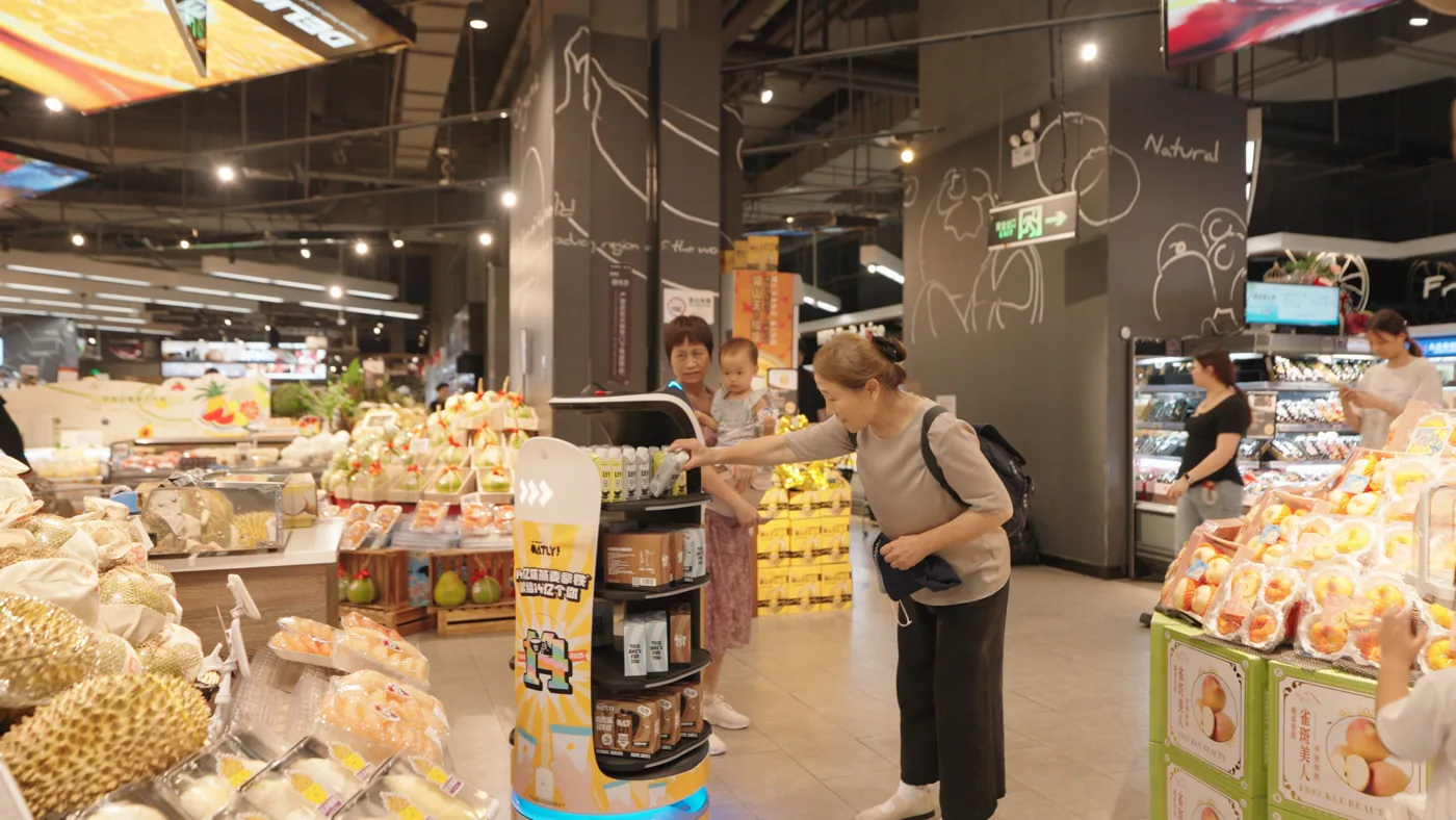Cleaning a supermarket aisle during opening hours
