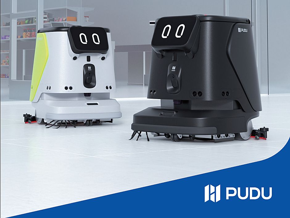 PUDU CC1 Pro AI cleaning robots on a commercial floor